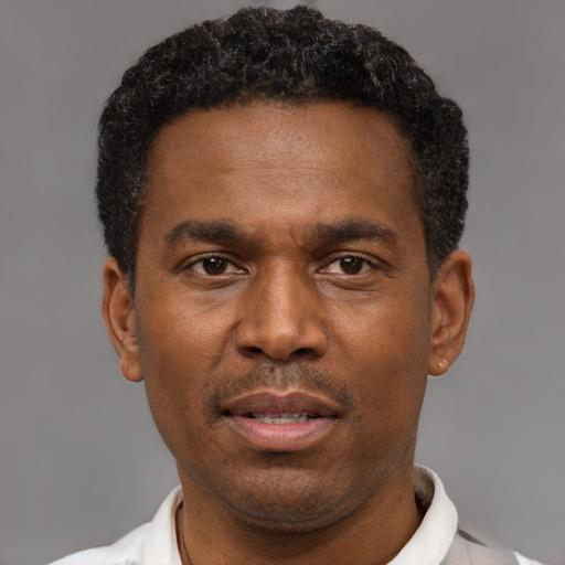 Neutral latino adult male with short  black hair and brown eyes