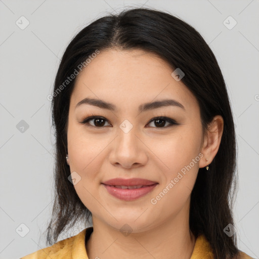 Joyful latino young-adult female with medium  brown hair and brown eyes