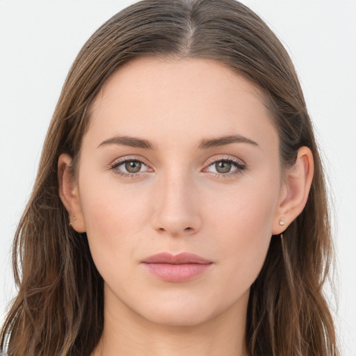 Joyful white young-adult female with long  brown hair and grey eyes