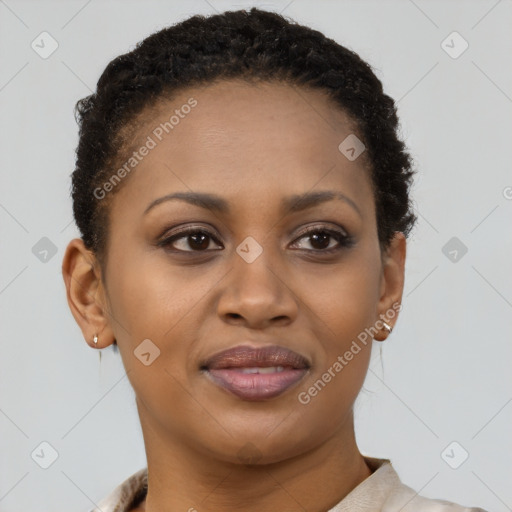 Joyful black young-adult female with short  brown hair and brown eyes