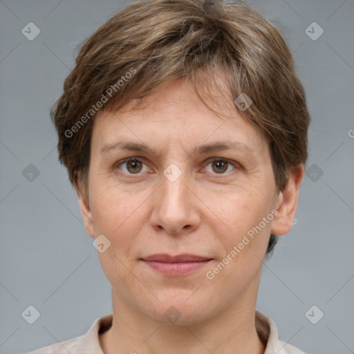 Joyful white adult female with short  brown hair and grey eyes