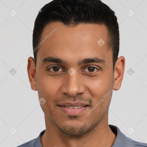 Joyful white young-adult male with short  black hair and brown eyes