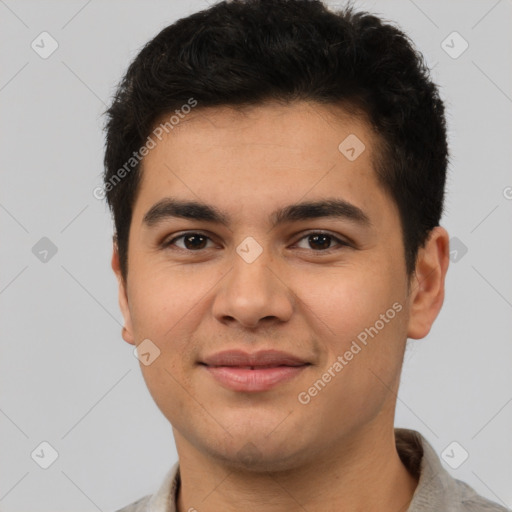 Joyful latino young-adult male with short  black hair and brown eyes