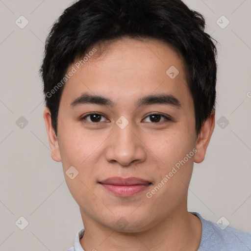 Joyful asian young-adult male with short  black hair and brown eyes