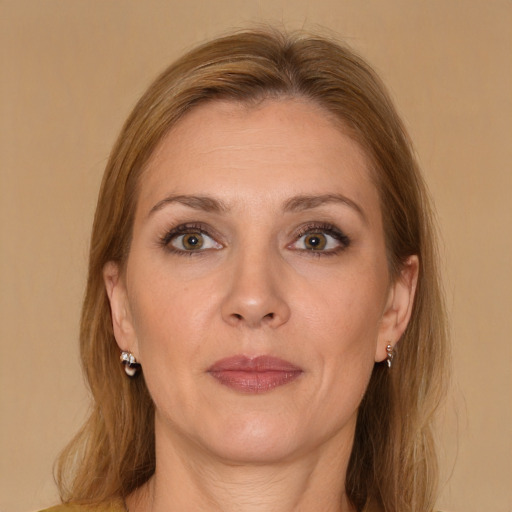 Joyful white adult female with medium  brown hair and brown eyes