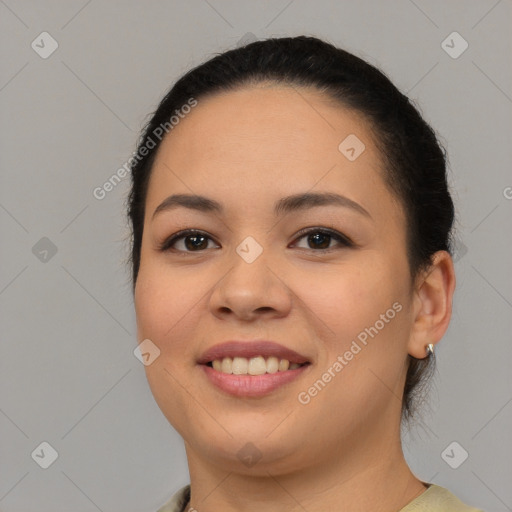 Joyful latino young-adult female with short  brown hair and brown eyes