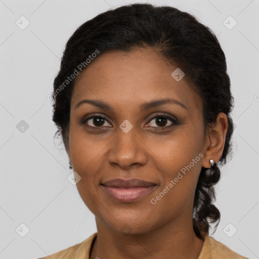 Joyful black adult female with medium  brown hair and brown eyes