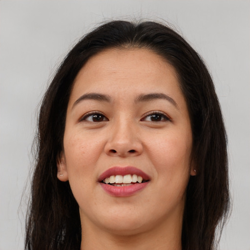 Joyful asian young-adult female with long  brown hair and brown eyes