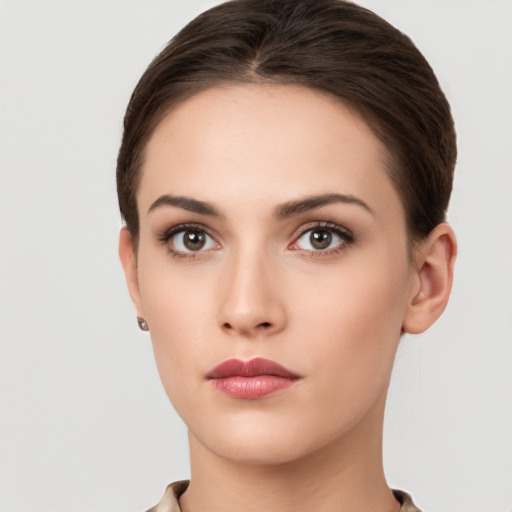 Neutral white young-adult female with short  brown hair and brown eyes