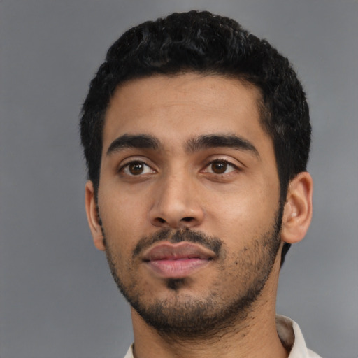 Neutral latino young-adult male with short  black hair and brown eyes