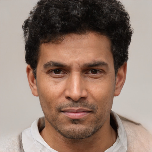 Neutral latino adult male with short  brown hair and brown eyes