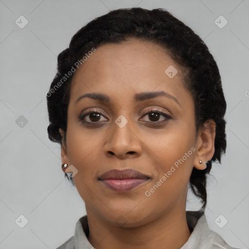 Joyful latino young-adult female with short  black hair and brown eyes