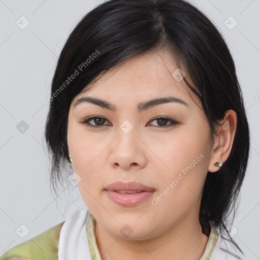 Joyful asian young-adult female with medium  brown hair and brown eyes