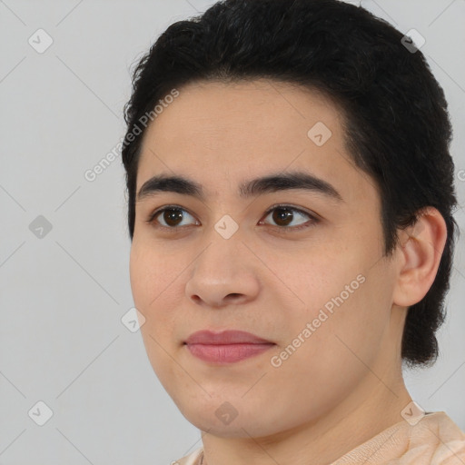 Joyful latino young-adult male with short  black hair and brown eyes