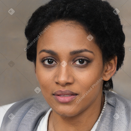 Joyful black young-adult female with short  black hair and brown eyes