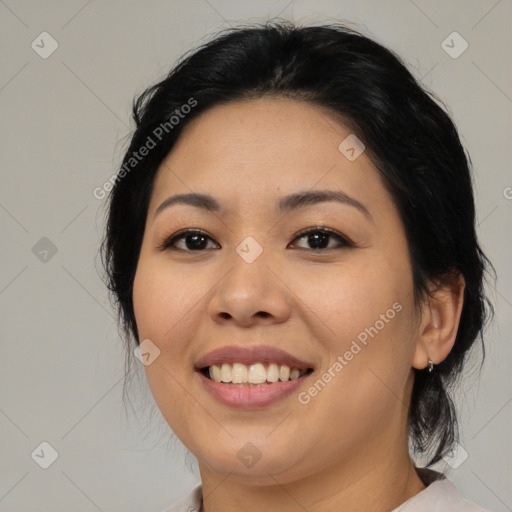 Joyful asian young-adult female with medium  brown hair and brown eyes