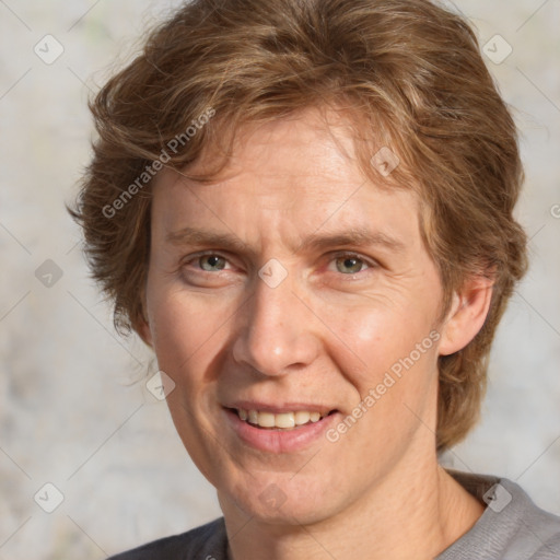 Joyful white adult male with short  brown hair and grey eyes