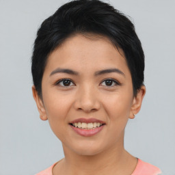 Joyful asian young-adult female with short  black hair and brown eyes