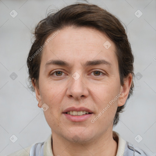 Joyful white adult female with short  brown hair and grey eyes