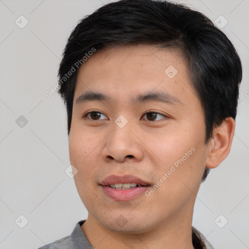 Joyful asian young-adult male with short  black hair and brown eyes