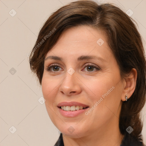 Joyful white adult female with medium  brown hair and brown eyes