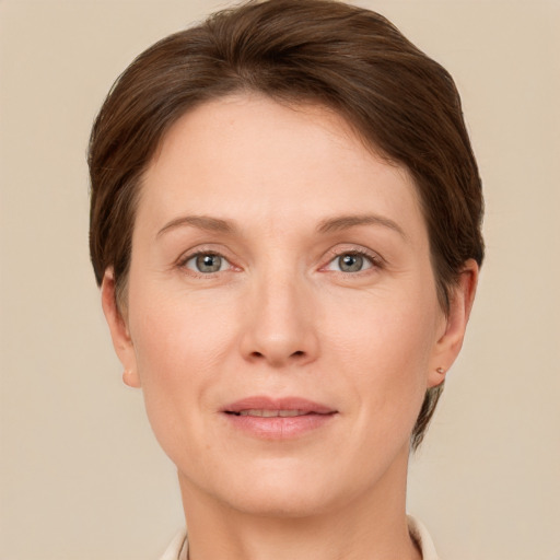 Joyful white adult female with short  brown hair and brown eyes