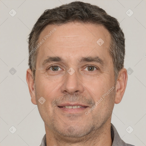 Joyful white adult male with short  brown hair and brown eyes