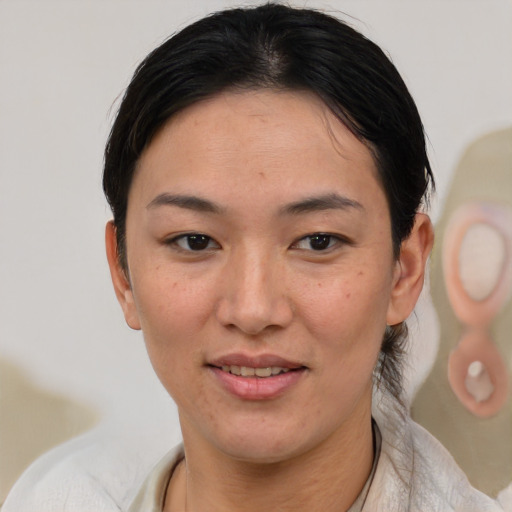 Joyful white adult female with short  brown hair and brown eyes