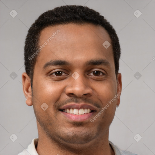 Joyful latino young-adult male with short  brown hair and brown eyes
