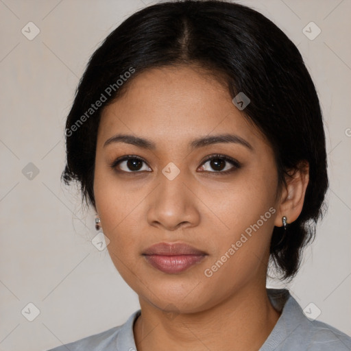 Joyful latino young-adult female with medium  black hair and brown eyes