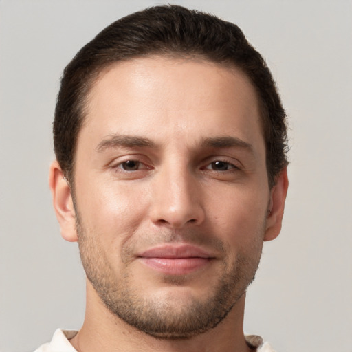 Joyful white young-adult male with short  brown hair and brown eyes