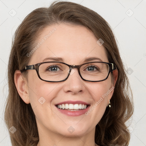 Joyful white young-adult female with medium  brown hair and blue eyes