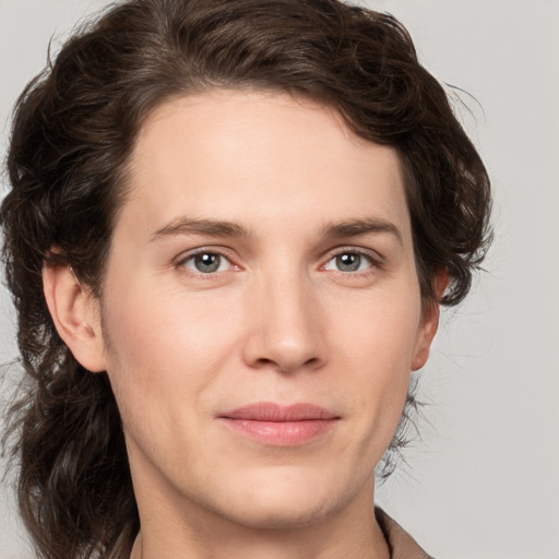 Joyful white young-adult male with medium  brown hair and brown eyes