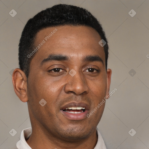 Joyful black young-adult male with short  black hair and brown eyes