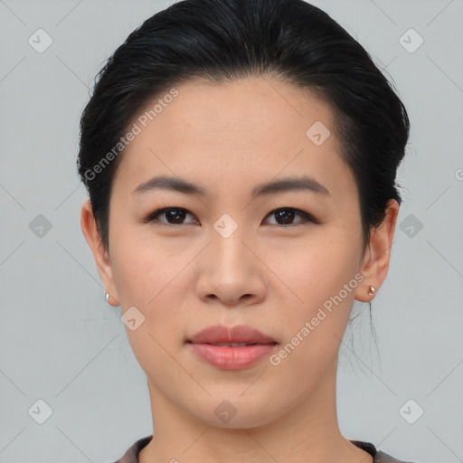 Joyful asian young-adult female with short  black hair and brown eyes