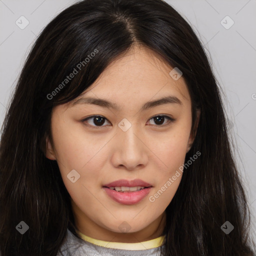 Joyful asian young-adult female with long  brown hair and brown eyes