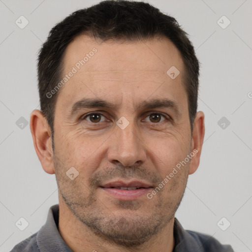 Joyful white adult male with short  brown hair and brown eyes