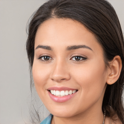 Joyful white young-adult female with medium  brown hair and brown eyes