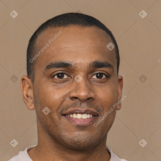 Joyful latino young-adult male with short  brown hair and brown eyes
