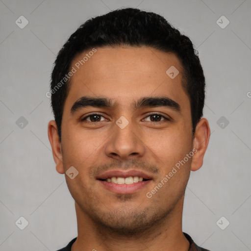 Joyful latino young-adult male with short  black hair and brown eyes