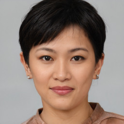 Joyful asian young-adult female with short  brown hair and brown eyes