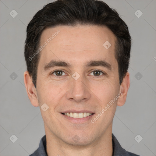 Joyful white adult male with short  brown hair and brown eyes