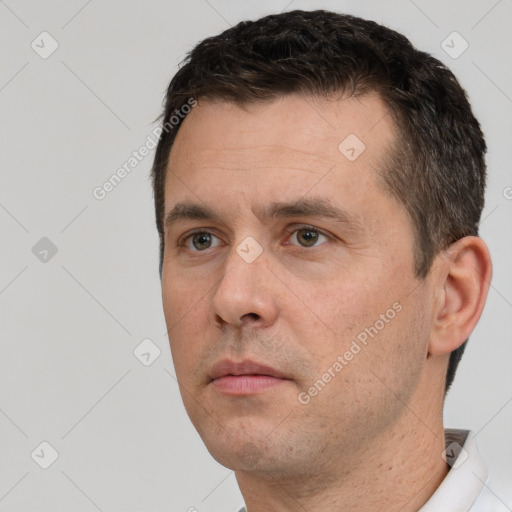 Neutral white adult male with short  brown hair and brown eyes