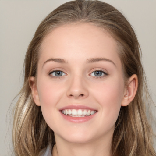 Joyful white young-adult female with long  brown hair and blue eyes