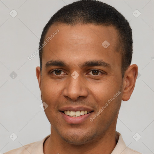 Joyful latino young-adult male with short  brown hair and brown eyes
