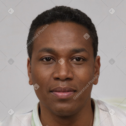 Joyful black young-adult male with short  black hair and brown eyes