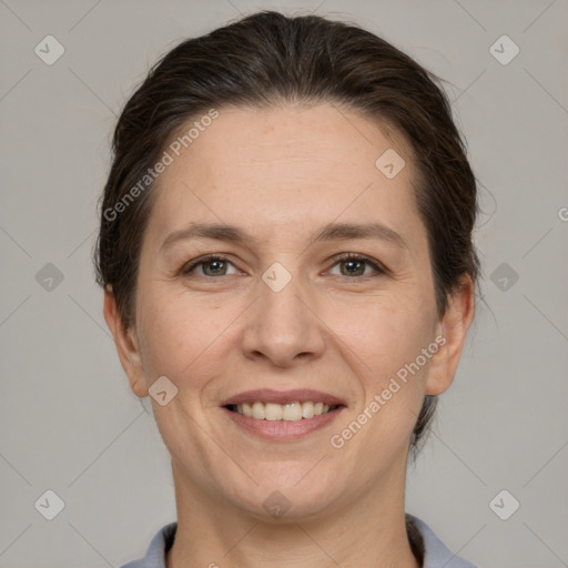 Joyful white adult female with short  brown hair and brown eyes