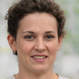 Joyful white adult female with short  brown hair and grey eyes