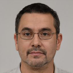 Neutral white adult male with short  black hair and brown eyes