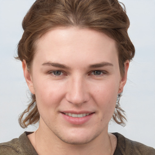 Joyful white young-adult female with short  brown hair and grey eyes